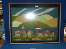 A framed felt patchwork of a sailing scene, 31" x 25".