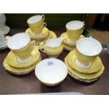 A quantity of Colclough teaware in yellow including eight cups, eleven saucers,