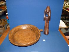 A large carved bowl with handle, 20'' diameter approx.