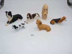 A quantity of dog figures including Border Fine Arts spaniel, Aynsley dachshund, basset hound,
