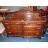 A Walnut/Mahogany Sideboard having an upstand including a pair of bevelled mirror panels,