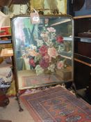 A mirrored Firescreen having painted red and pink roses, signature G. Bourter, 19" wide x 27" high.