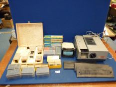 A Gnome Supreme slide projector and a Halina Paramount slide viewer, plus slides.