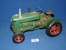 A green metal model tractor by Lesser and Pavey Ltd., 10 1/2" x 6".