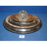 An oval ebonised and walnut Inkstand with fixed hexagonal shape glass inkwell, a/f,