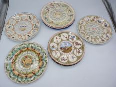 A quantity of Wedgwood calendar wall plates, David Fisher 'The Miner', etc.