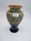 A Royal Doulton Lambeth vase in blue and green with pale blue and ochre stylized foliage and