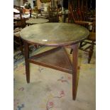 A period Cricket Table of principally Elm construction, the legs united by a triangular lower shelf,