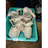 A graduated set of four Charles Meigh style 'Apostle' moulded jugs in white (A/F),