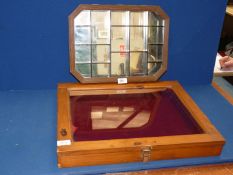 A stained Pine glass topped table cabinet with red velvet lining,