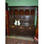 An imposing, profusely carved Oak Welsh Dresser,