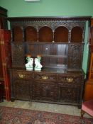 An imposing, profusely carved Oak Welsh Dresser,