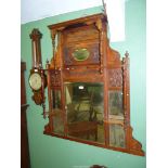 A probably Edwardian Mahogany framed Overmantel Mirror with turned supports,