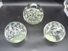 Three large heavy dumps with internal random bubbles, largest one being 7" tall.