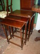 A nest of three spindle turned legged Mahogany occasional Table,
