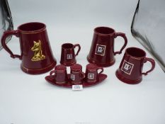 A graduated set of Whitbread tankards and a matching cruet set.
