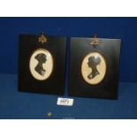 A pair of silhouettes on paper of Regency ladies in ebonised and brass frames, 4 3/4" x 5 3/4".