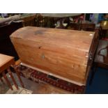 A dome topped Pine chest of tapering shaped and having a separate lift-out internal tray and having