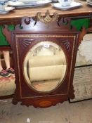 A shell feature bevel edge wooden wall mirror having shaped pediment, 19" x 32".