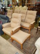 An "Ercol" elm framed Lounge Suite comprising a pair of armchairs,