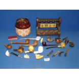 A tray containing briar and meerschaum pipes,