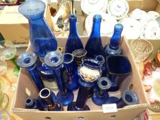 A quantity of blue glass to include; four candlesticks, four vases having floral decoration,