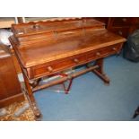 An unusual Mahogany circa 1900 writing Desk having three frieze drawers to the rear of the writing