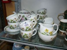 A Royal Worcester 'Worcester Herbs' tea service for ten people, no bread and butter plate.