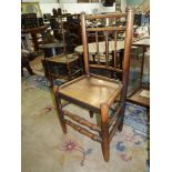 An Ash and other woods Clisset side Chair having a solid seat,