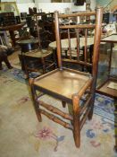 An Ash and other woods Clisset side Chair having a solid seat,