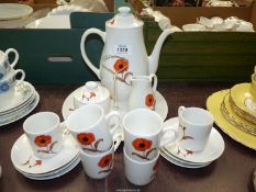 An Avon Yugoslavia six part tea set with a poppy design and a biscuit plate.