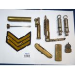 A small quantity of miscellanea including two Air raid precautions whistles, silver ARP badge,