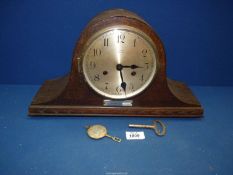 A Napoleon shaped oak finished mantle Clock by T.