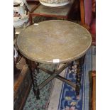 A Benares table and stand, 23 1/2" diameter.