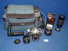 A Pentax 35mm camera (a/f.) with assorted lenses and bag.