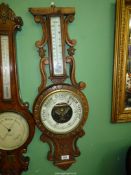 A carved Oak banjo Barometer with mercury thermometer, 33" tall, top missing.