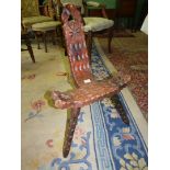 A rustic Pine and other woods arts and crafts spinning Chair having pierced and carved details and