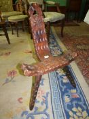 A rustic Pine and other woods arts and crafts spinning Chair having pierced and carved details and