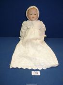 A vintage doll with porcelain face, signed on back of the neck A.M. Germany, 12".