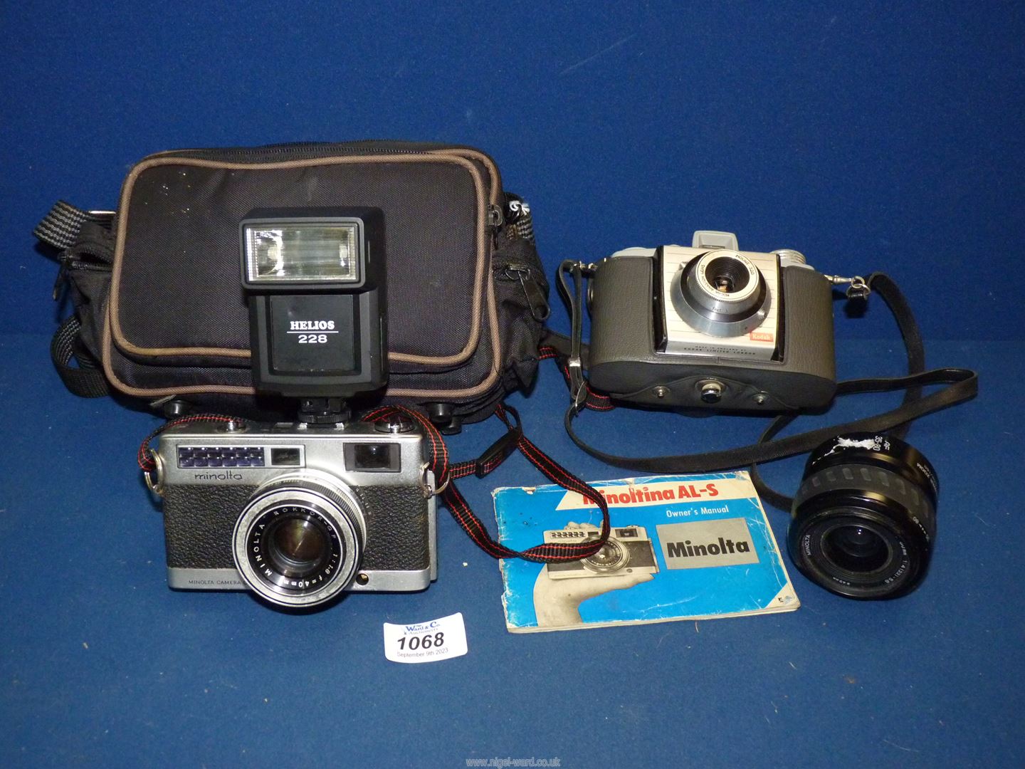 A Japanese Minolta Rokkor A1-S camera with Helios flash and Minolta power zoom lens all in carrying