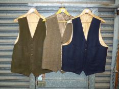 A gents woolen Waistcoat with mustard silk lining, size 46, a Harris Tweed waistcoat,