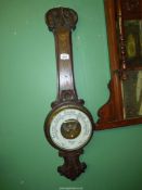 An Oak Barometer by Dolland London (a/f, thermometer missing). 33" tall.