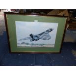 A framed and mounted Print taken from a photograph depicting a Vulcan Bomber XH558 at an air show,