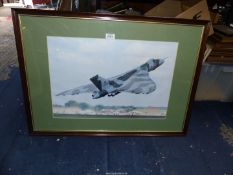 A framed and mounted Print taken from a photograph depicting a Vulcan Bomber XH558 at an air show,