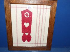 A framed tapestry of a Welsh Love Spoon (vintage frame).