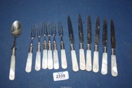 A set of pastry knives and forks with Mother of Pearl handles and similar preserve spoon.