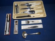 A quantity of cutlery to include dinner knives, bread knives, cheese knife,