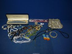 A box of miscellaneous jewellery including beaded necklaces and beaded handbags etc.