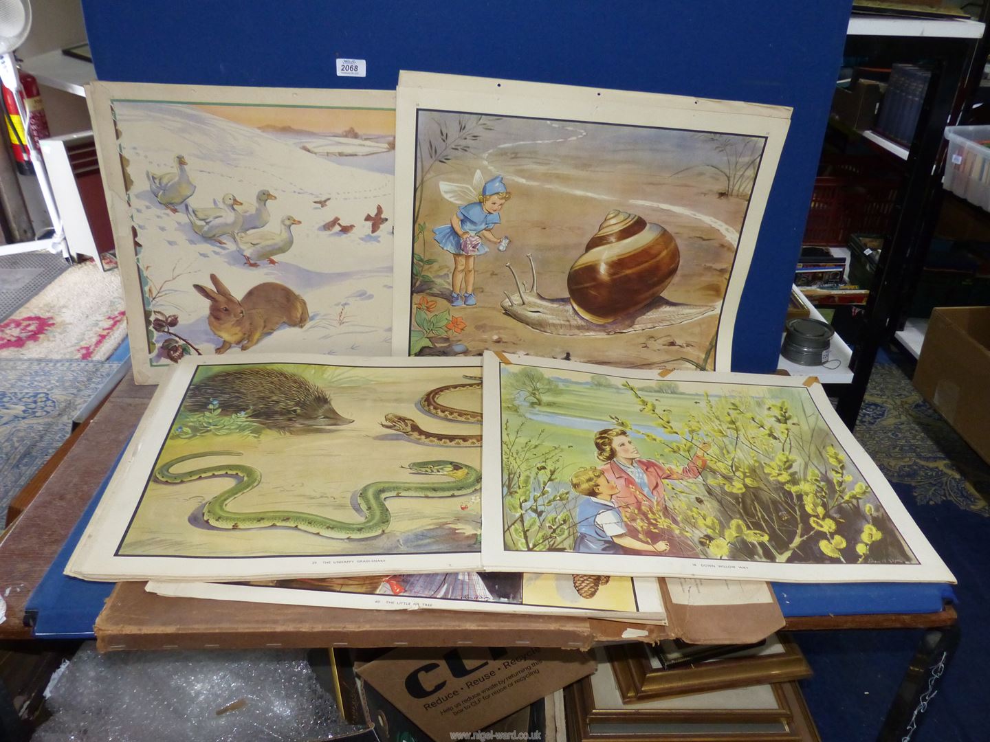 A cardboard case containing Enid Blyton nature plates, some a/f.