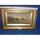 A framed Oil on canvas depicting cottages and a village church, signed lower right 'Grace Grinham'.